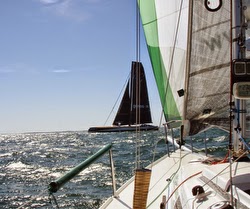 J/80 passing monster trimaran off La Trinite sur Mer, France